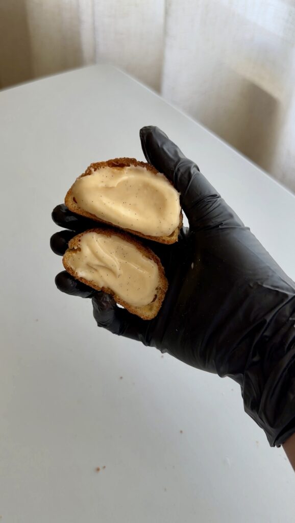 This easy golden choux pastry shells on a baking tray.